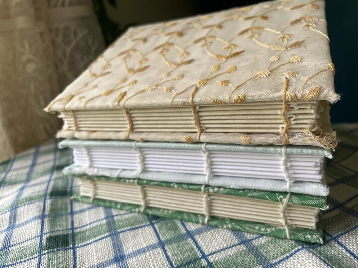 Three handbound notebooks with coptic stitching